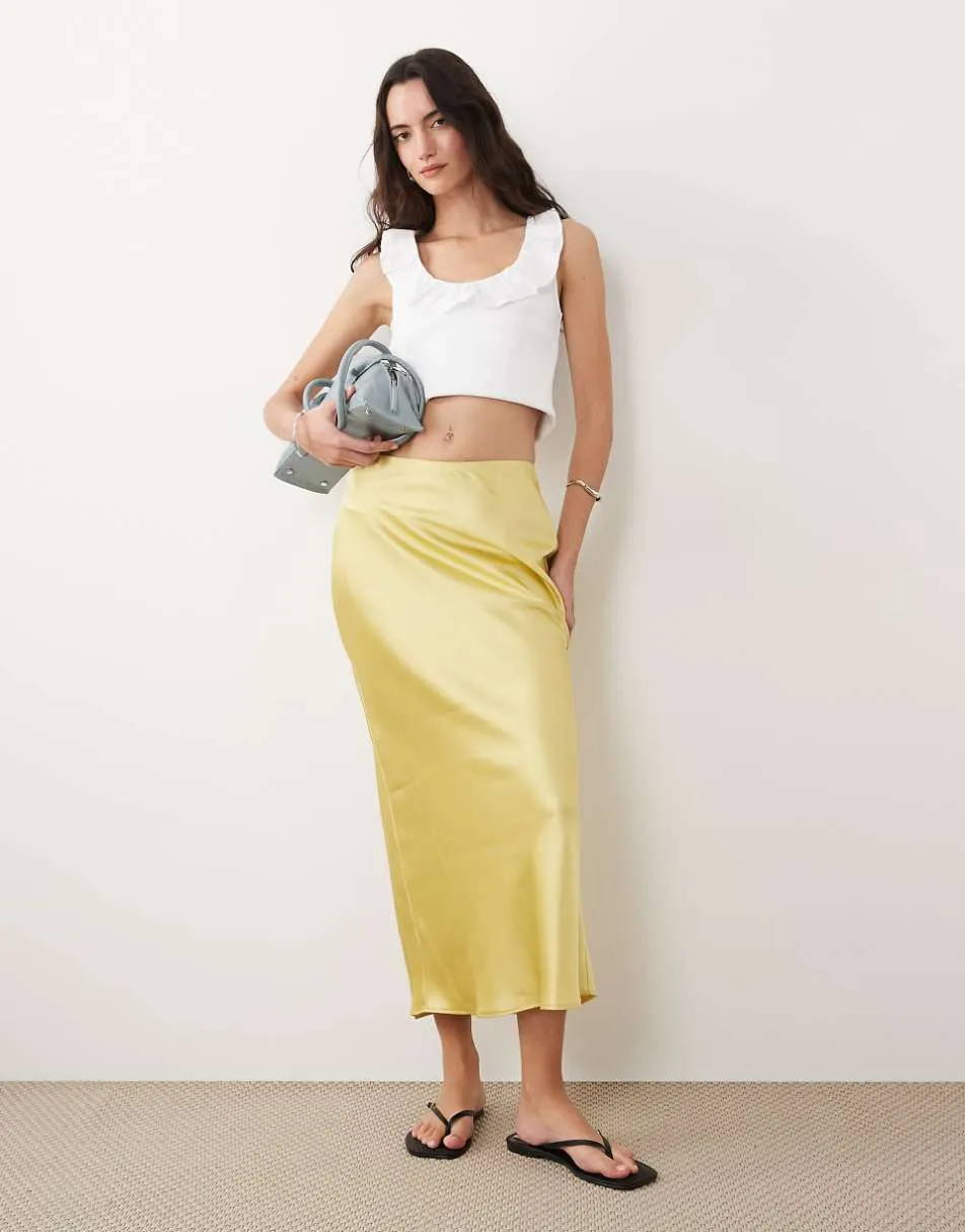 New Look satin bias midi skirt in lemon yellow