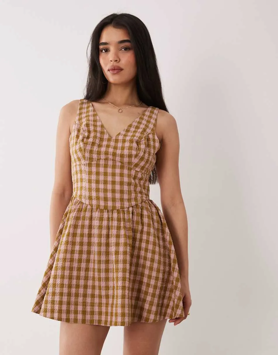 ASOS DESIGN waisted v neck mini sundress with seaming details in brown and pink check