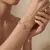 Dubbele armband in edelstaal met oogbedel en zirkonia's