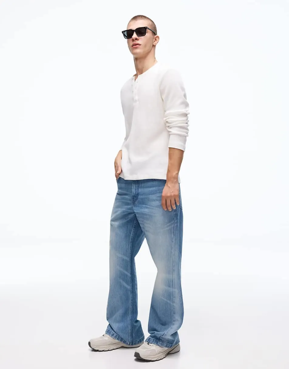 Bershka Baggy flared jeans in mid blue
