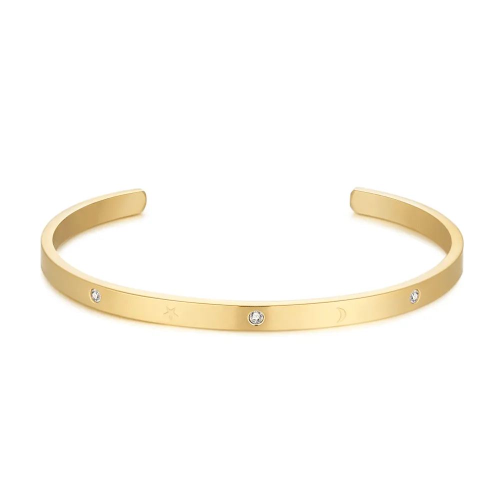 Armband in goudkleurig edelstaal, open bangle, kristallen, maantjes en sterretjes