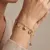 Armband in edelstaal, met hangers