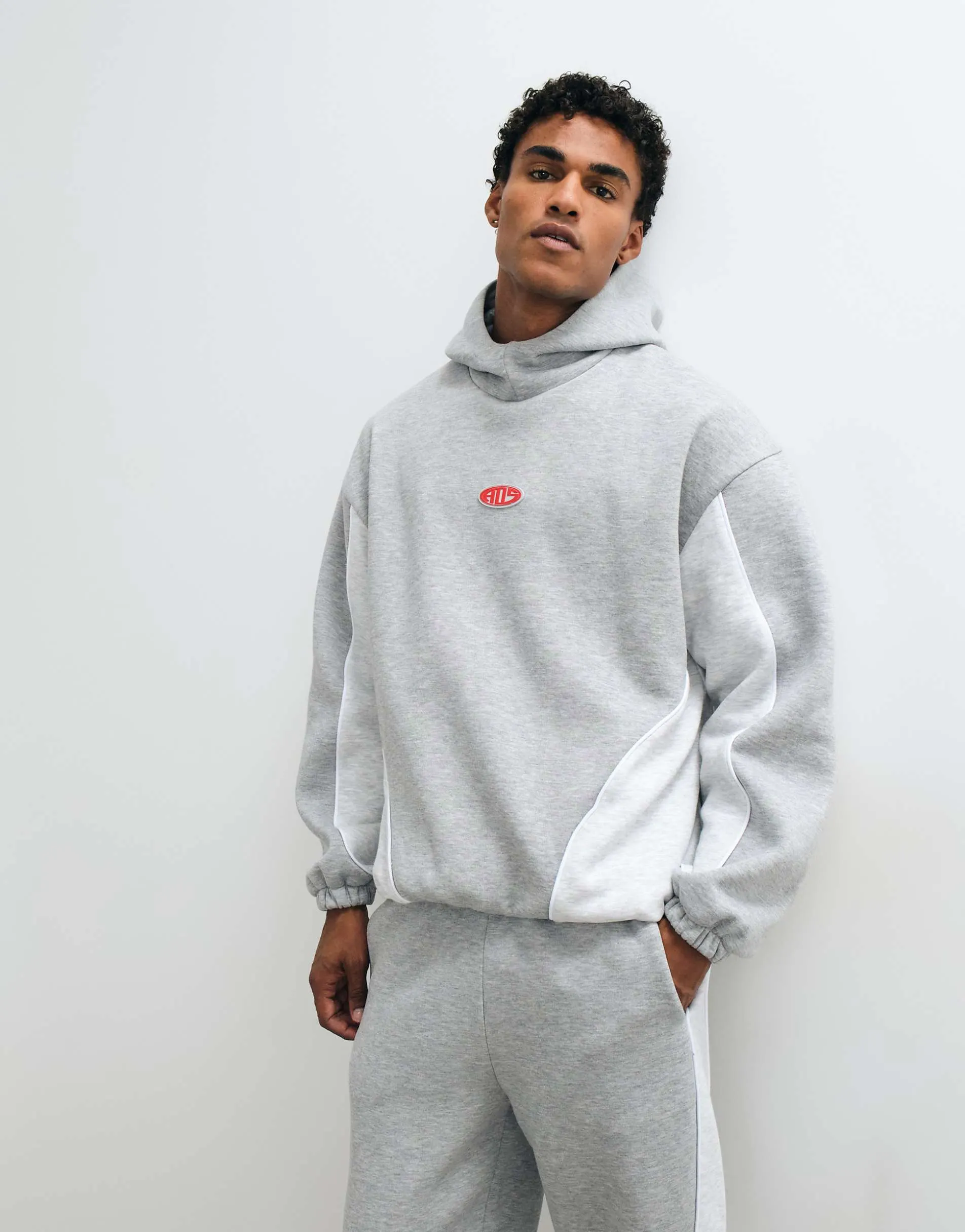 ASOS DESIGN oversized funnel hood with piping, cut and sew and rubber patch in grey marl