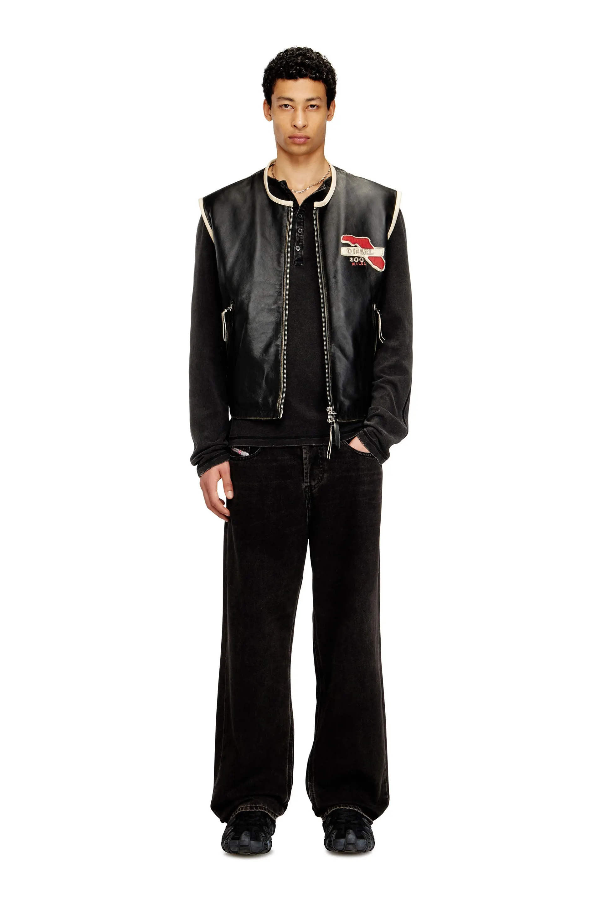 Leather vest with embroidered patches