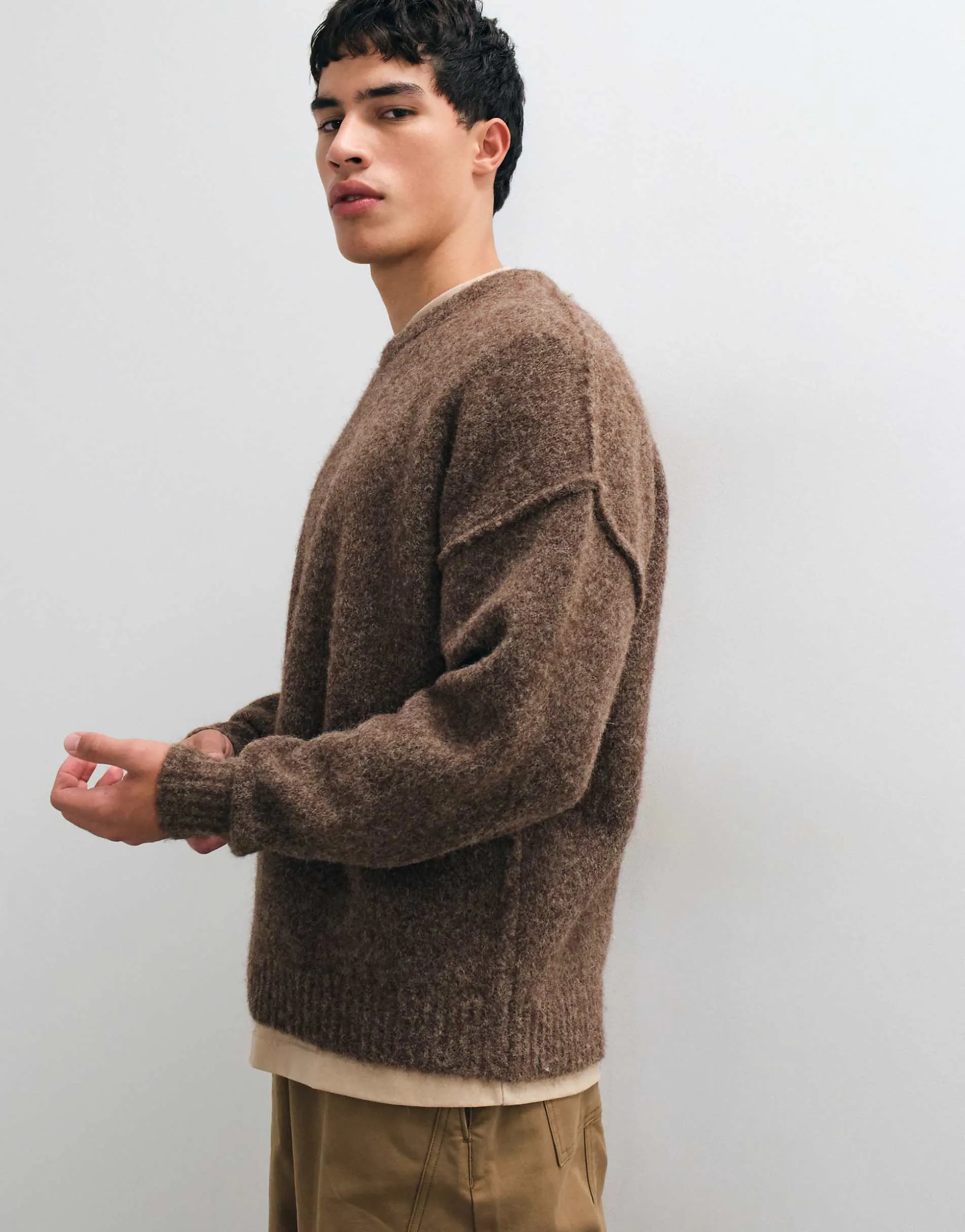 ASOS DESIGN relaxed knitted exposed seam crew neck jumper in brown