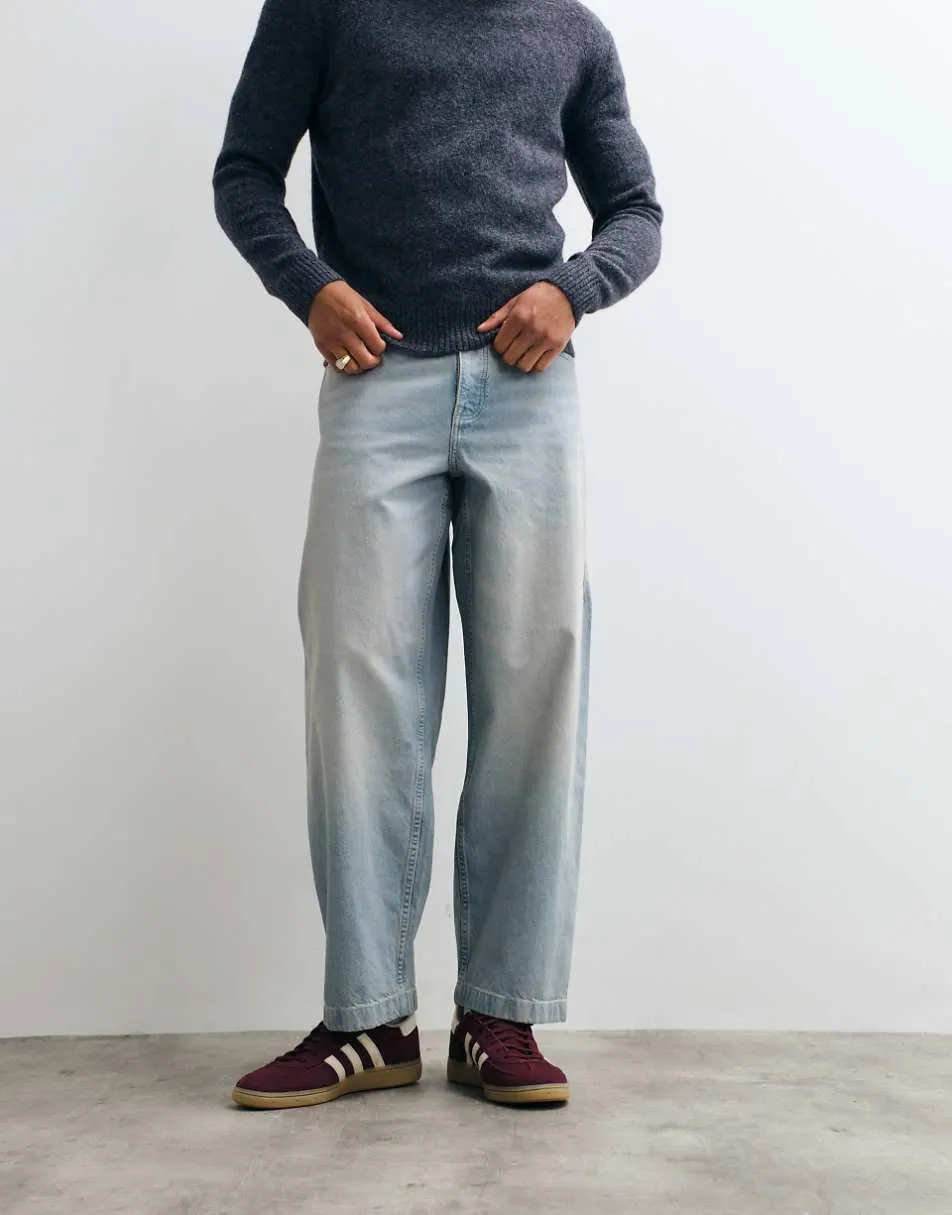 ASOS DESIGN loose straight jeans in light wash blue with pleats and buckle