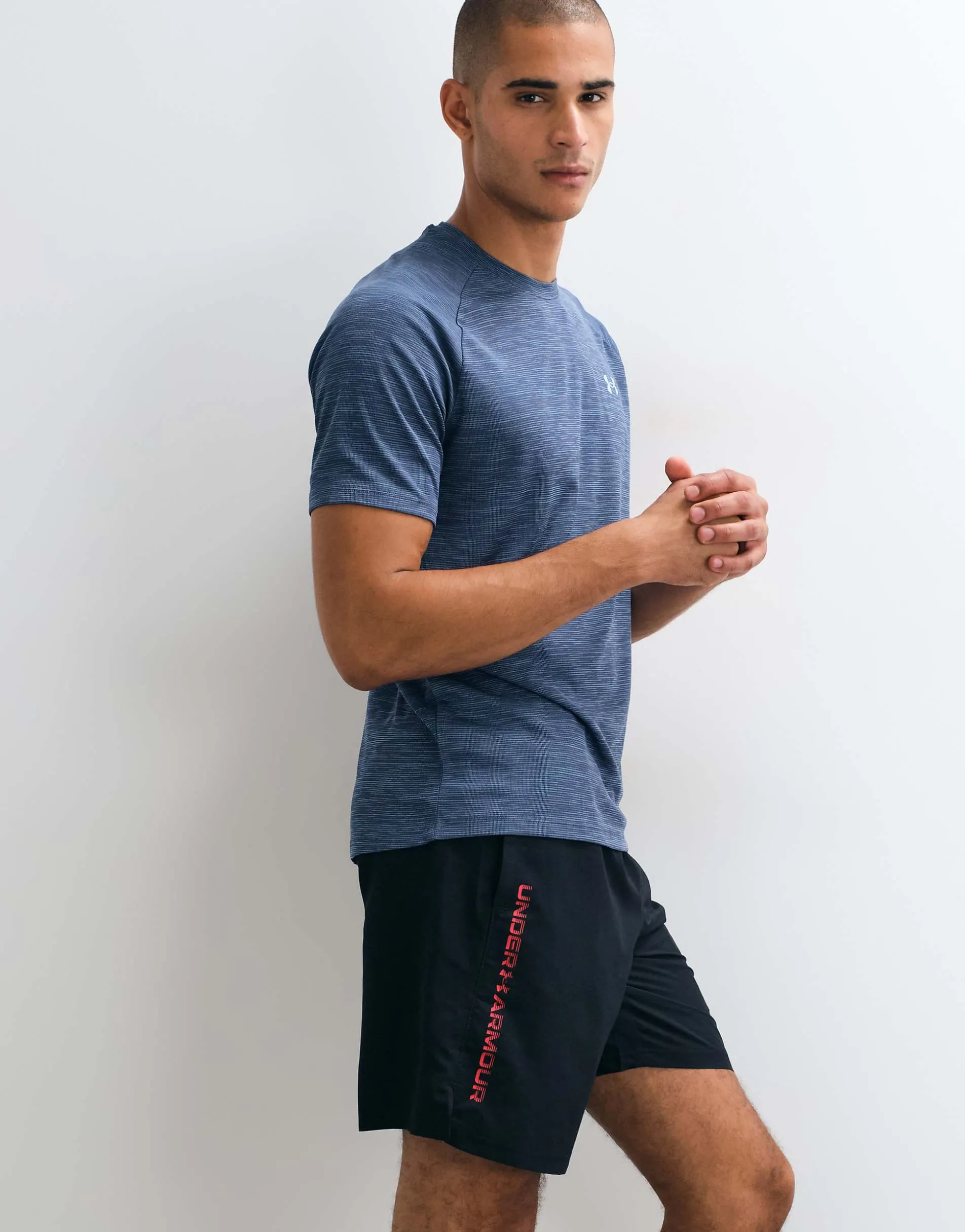 Under Armour Tech Woven Wordmark shorts in Black and Red