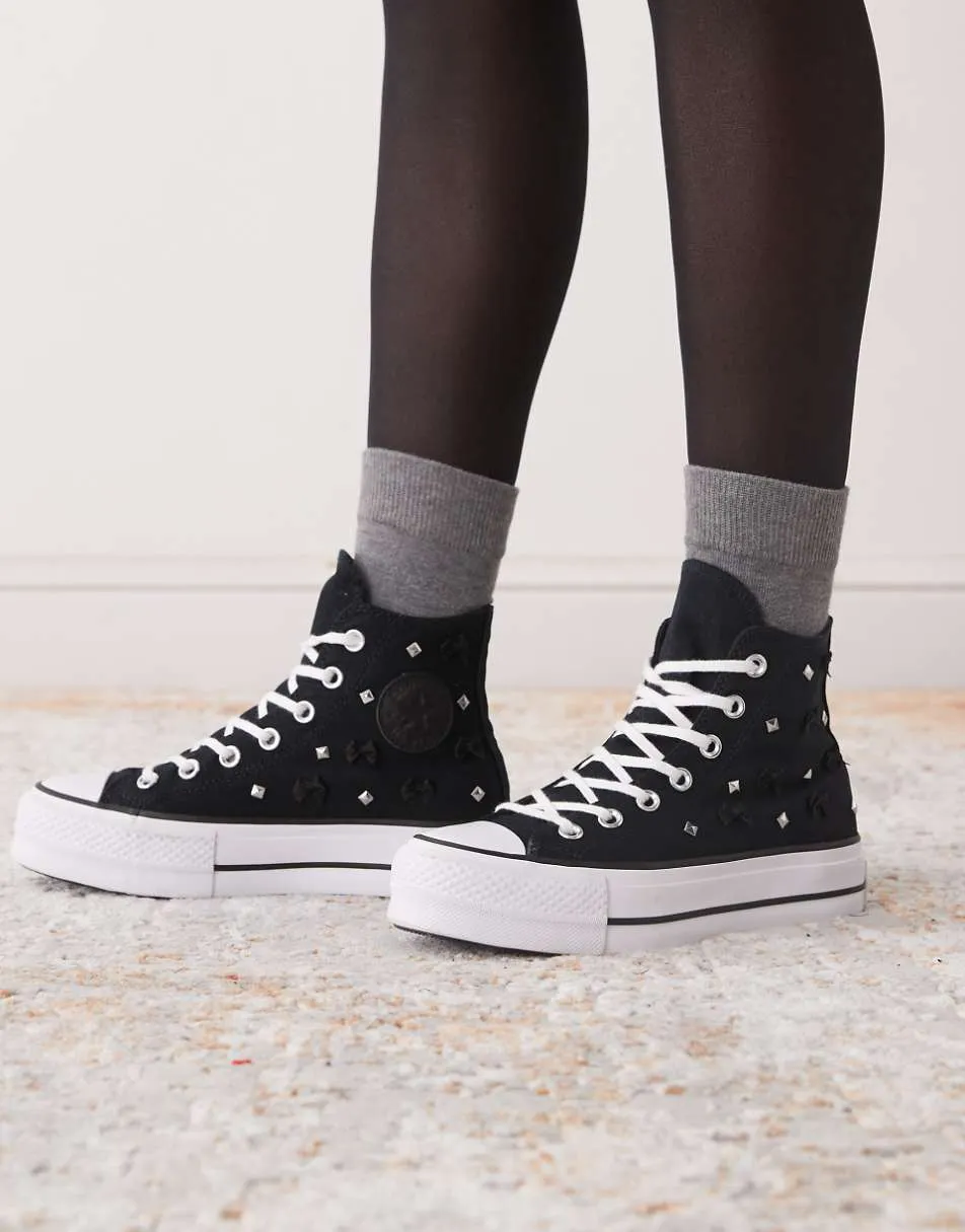 Converse Chuck Taylor All Star Lift Hi platform trainers in black with bows and studs