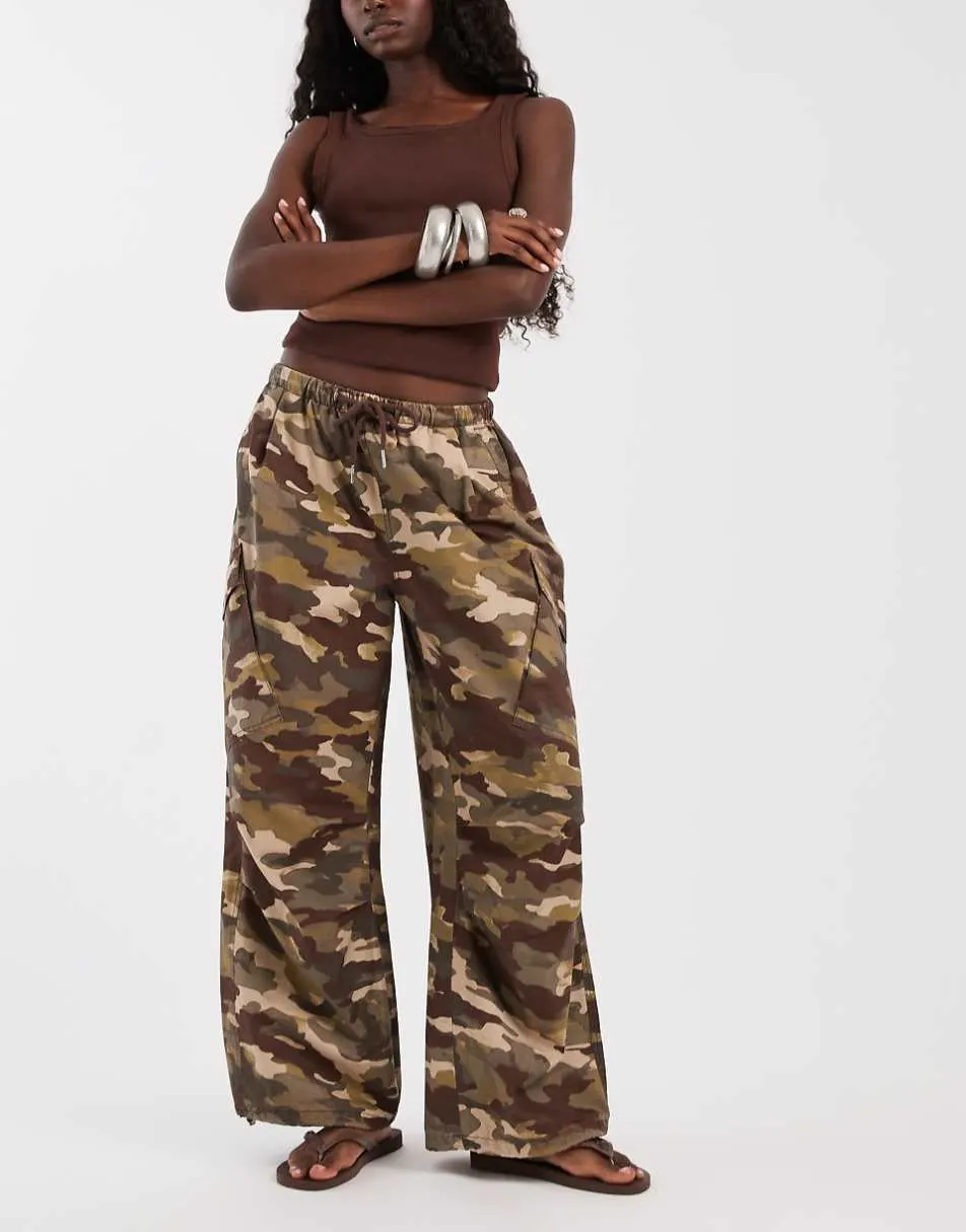 ASOS DESIGN cargo trouser with tie and pocket detail in camo print