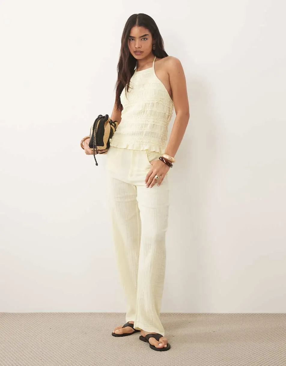 Mango Bora 100% cotton textured halterneck top & trouser co-ord in pastel yellow