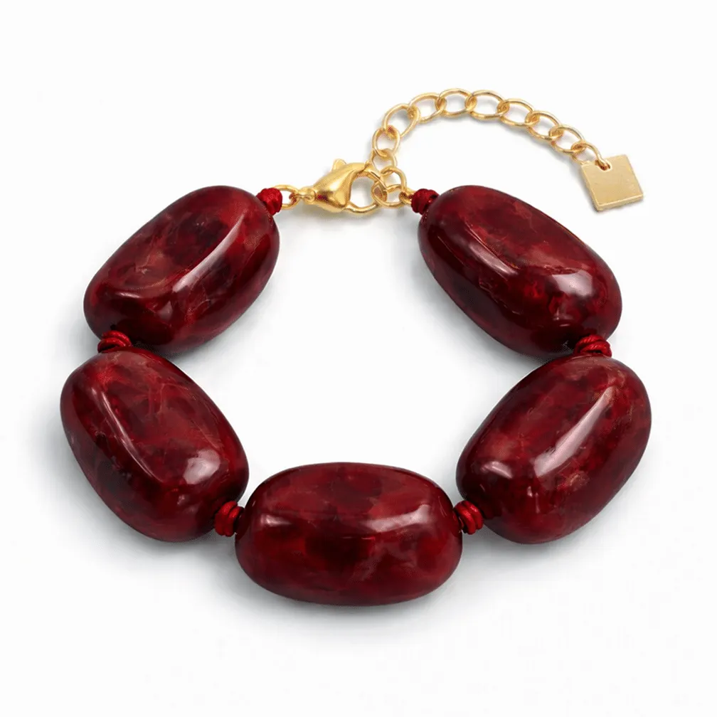 Armband in edelstaal, grote rode kralen
