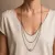 Halsketting in high fashion, meerdere lagen met kralen