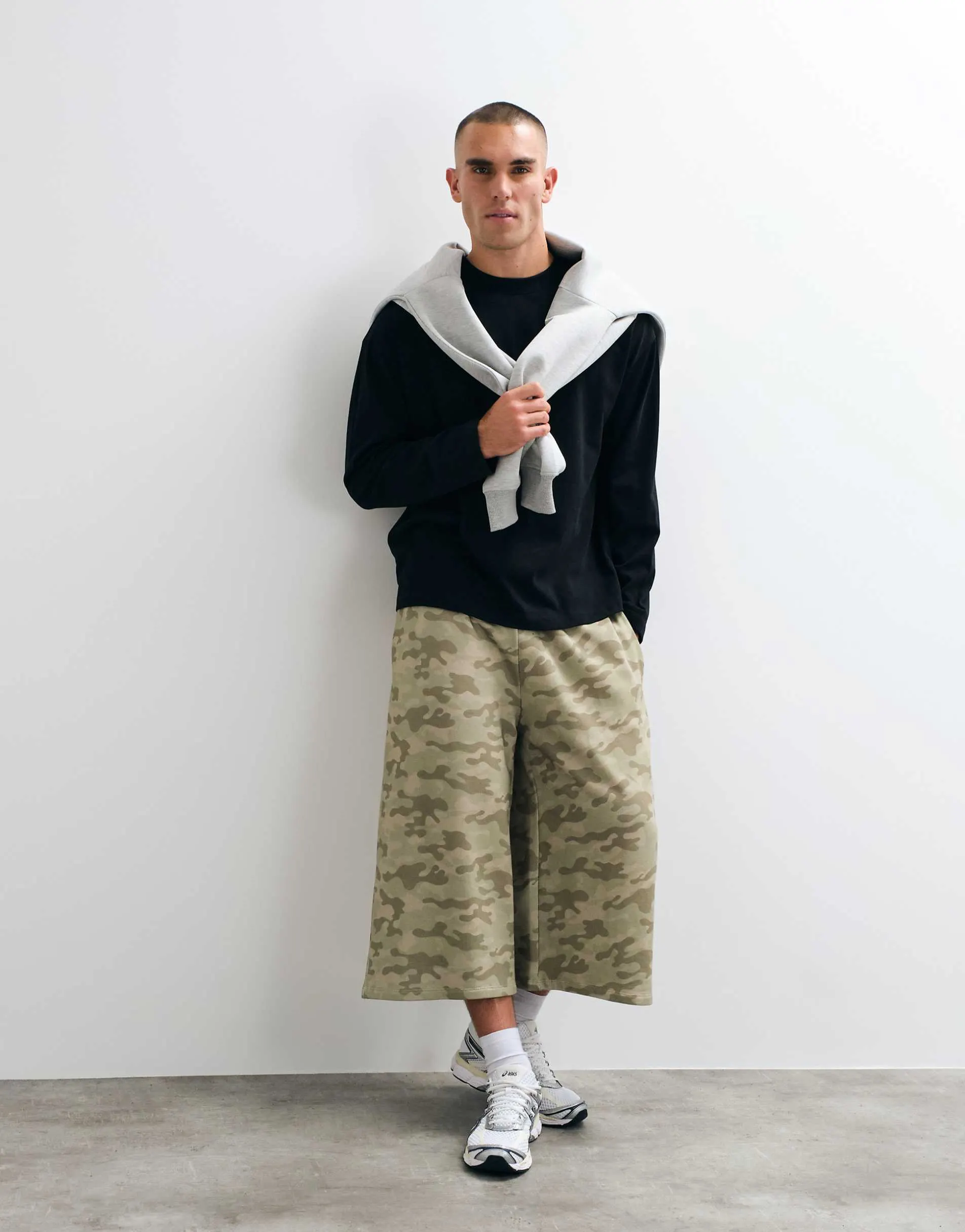 COLLUSION baggy longline shorts in camo print