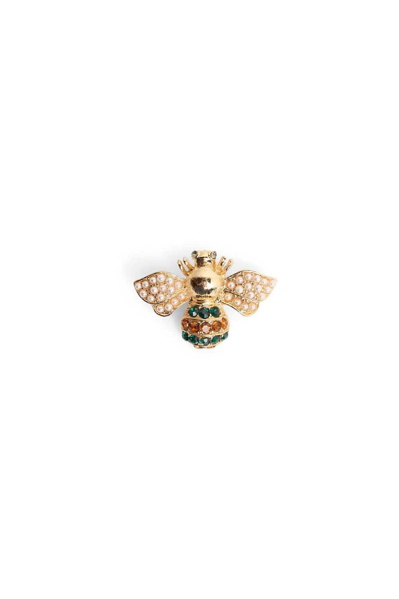 Goudkleurige broche bij