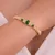 Armband in edelstaal met groene stenen