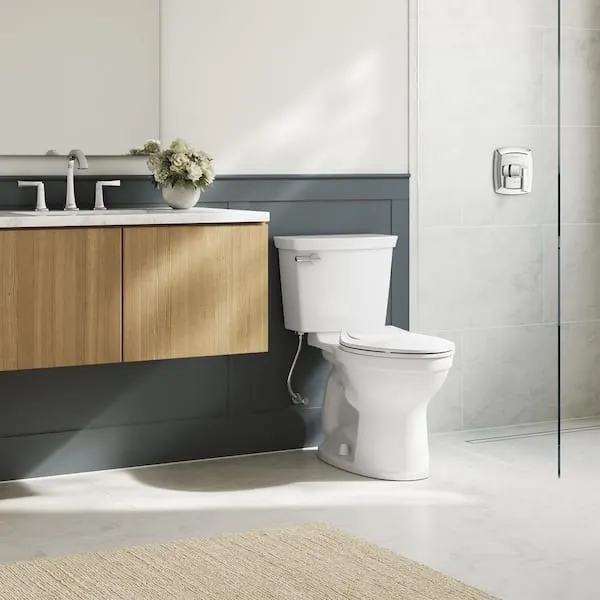 American Standard Champion Two-​Piece 1.​28 GPF Single Flush Elongated Chair Height Toilet with Slow-​Close Seat in White