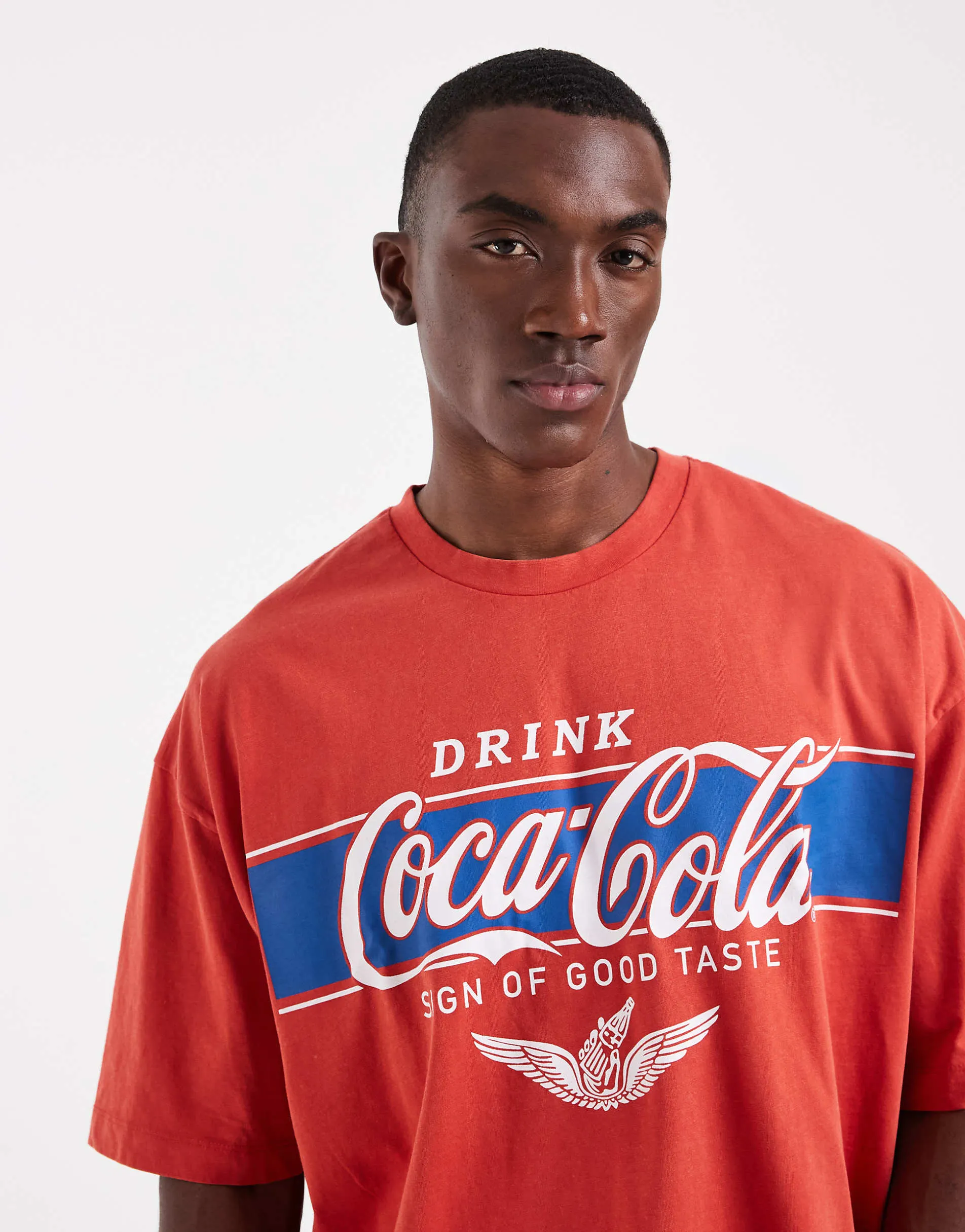 ASOS DESIGN oversized t-shirt with Coca-Cola print in red