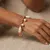 Armband in edelstaal, parels en hangers
