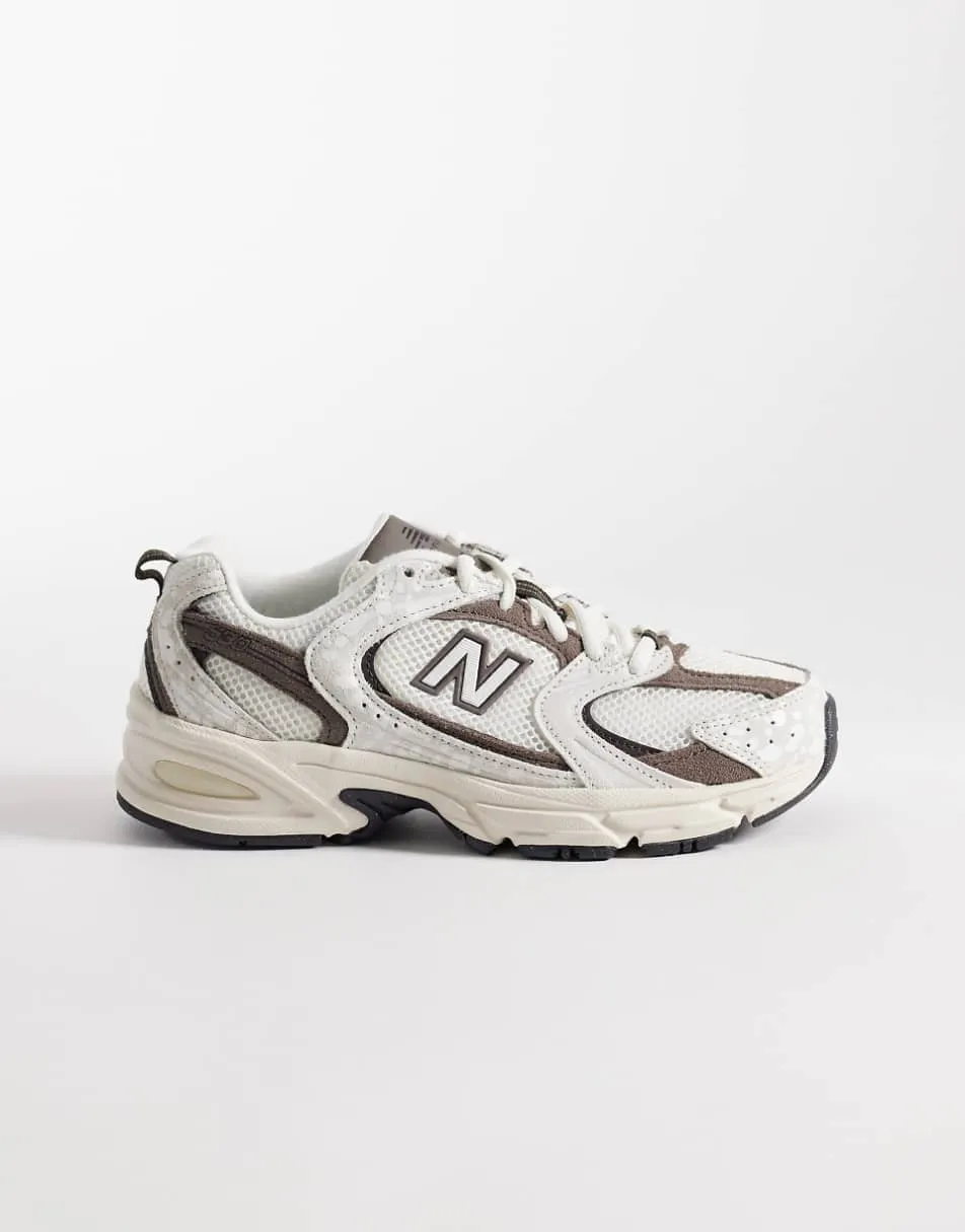 New Balance 530 trainers in off white and brown deer print