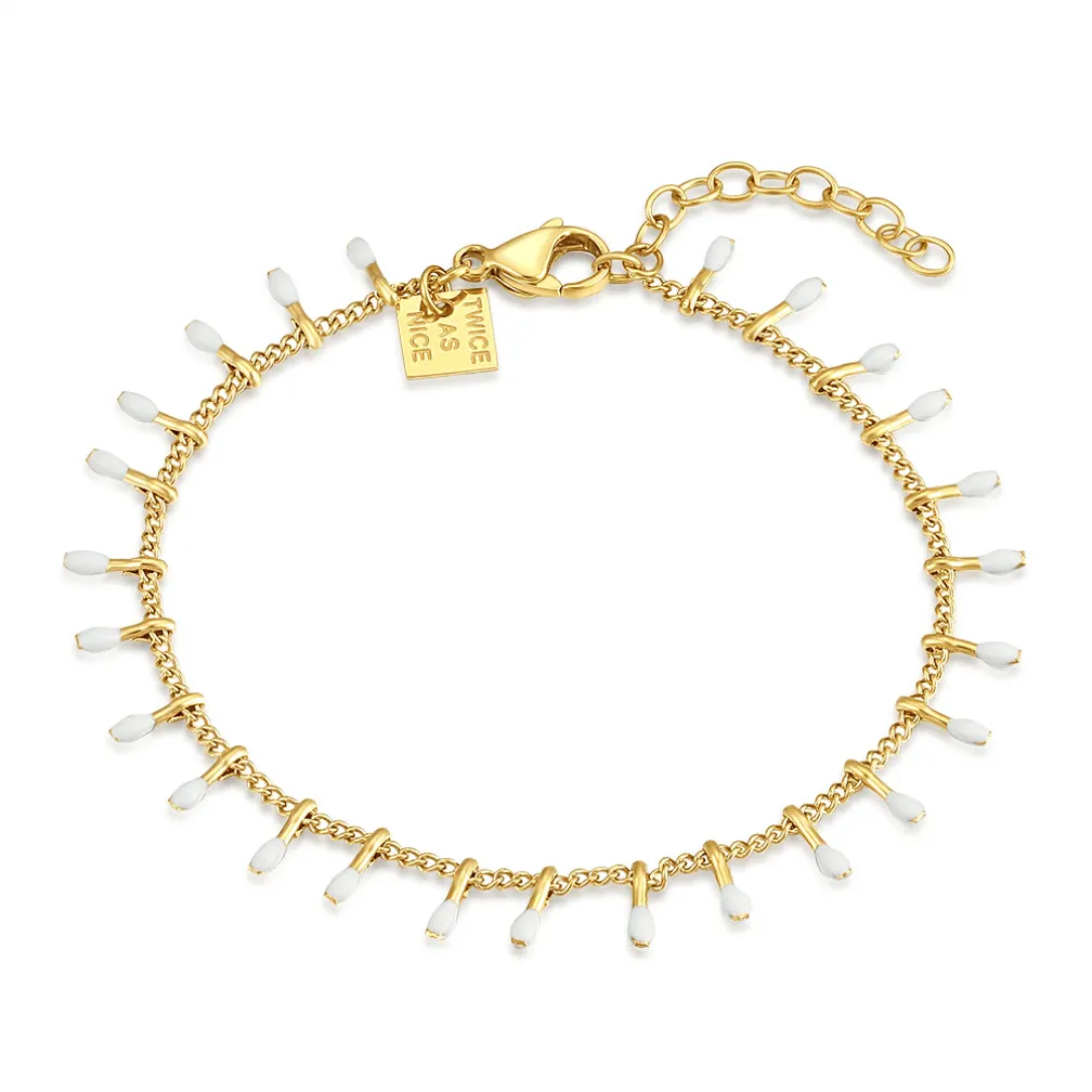 Armband in goudkleurig edelstaal, witte druppeltjes