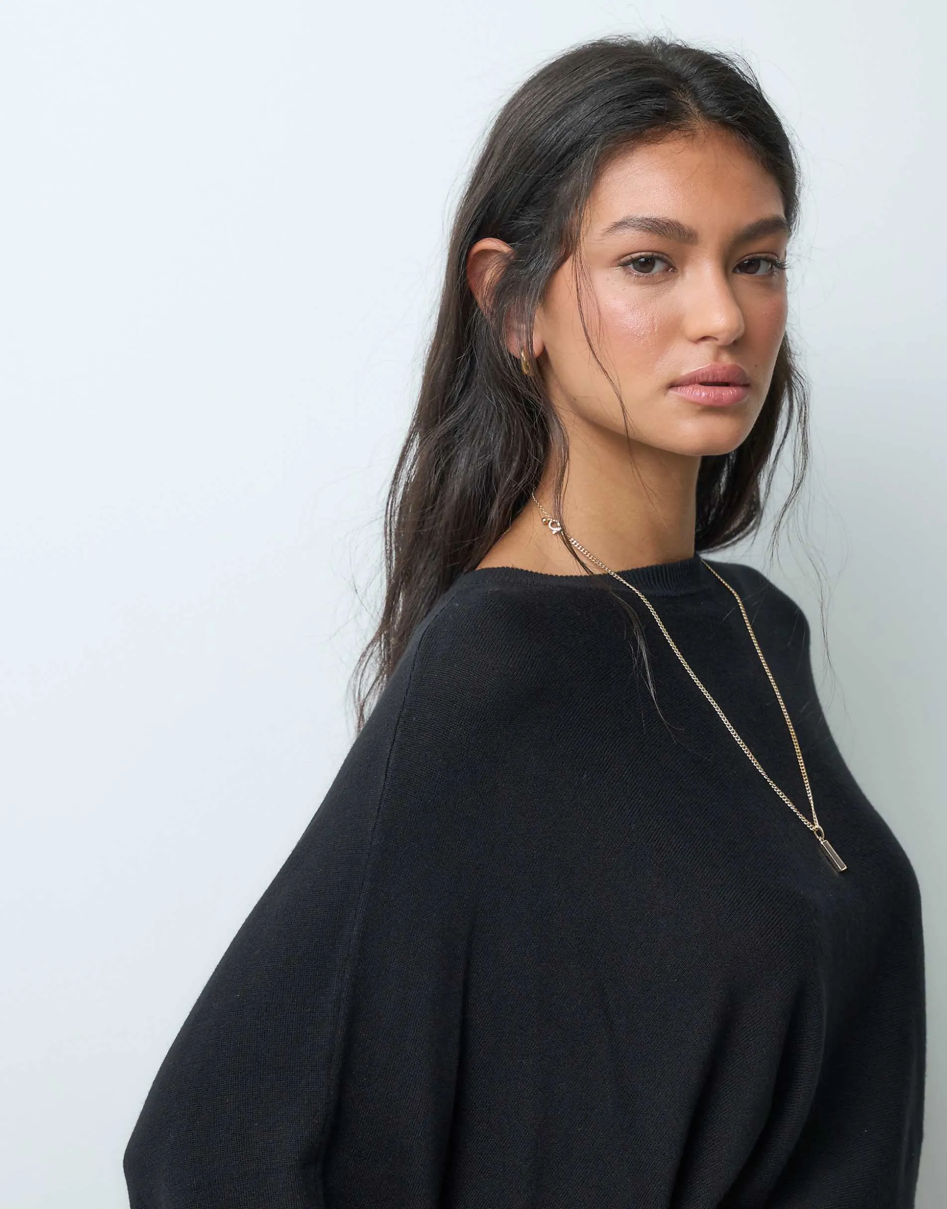 ASOS DESIGN knitted batwing waisted long sleeve top in black