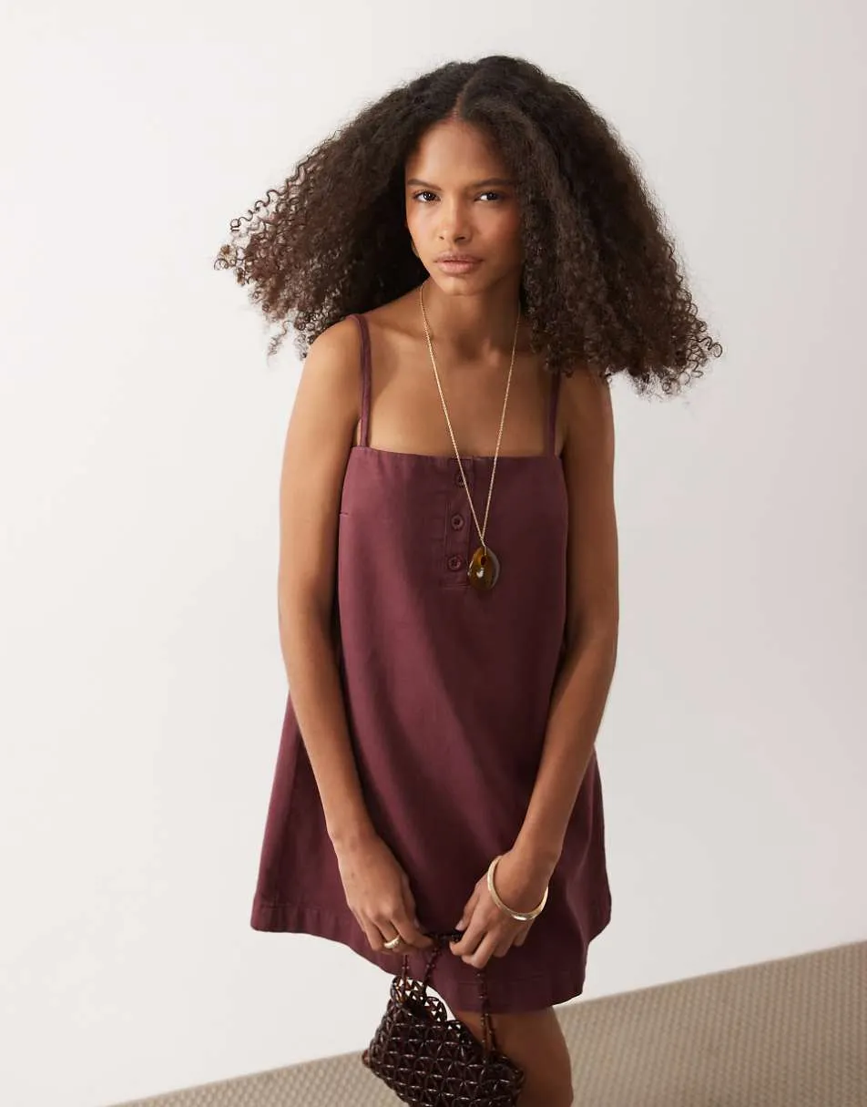 ASOS DESIGN denim cami mini dress with button detail in burgundy