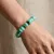 Armband in edelstaal, turquoise kralen