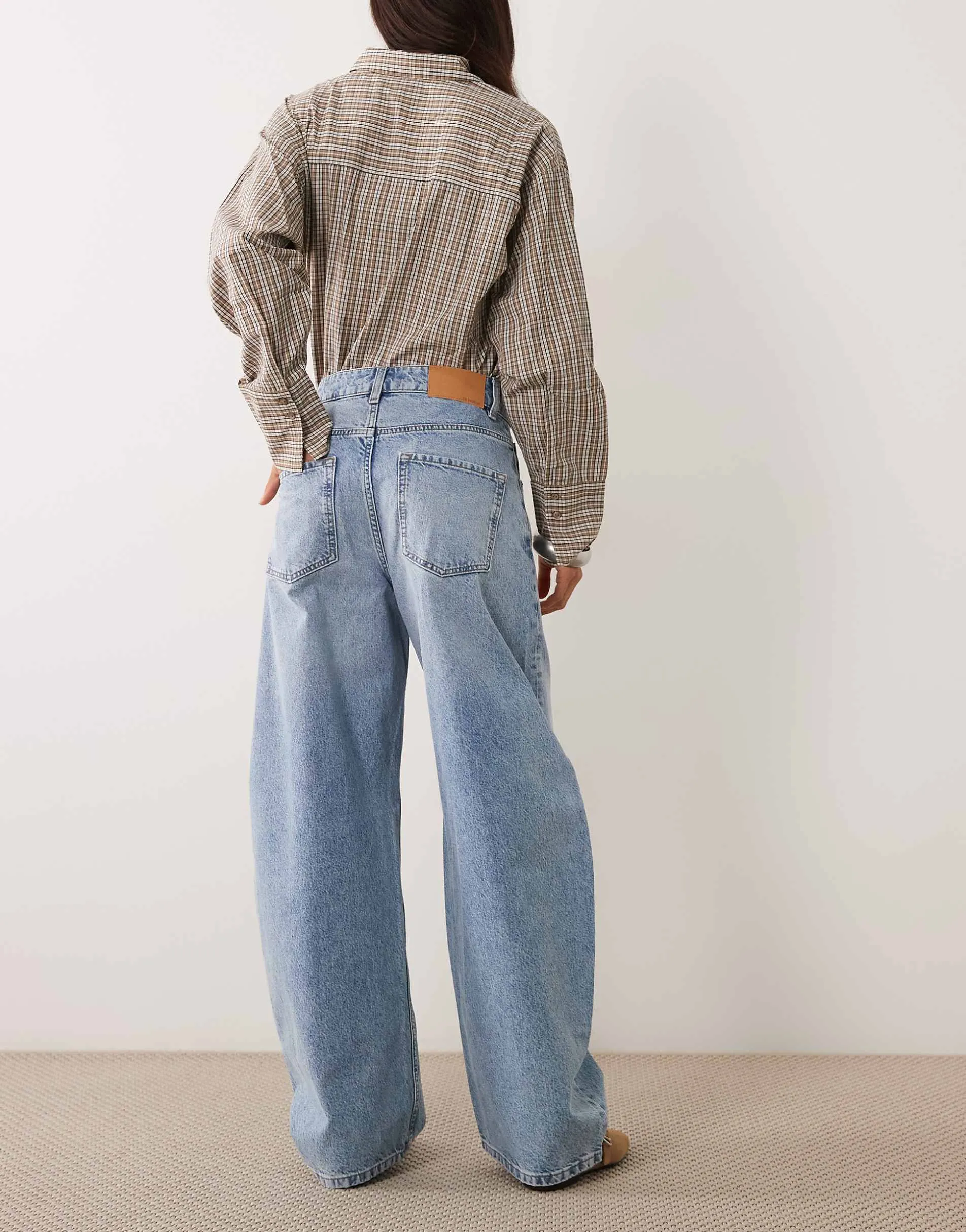 ASOS DESIGN high waisted barrel leg jeans in lightwash blue