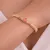 Armband in edelstaal, 3 roze stenen