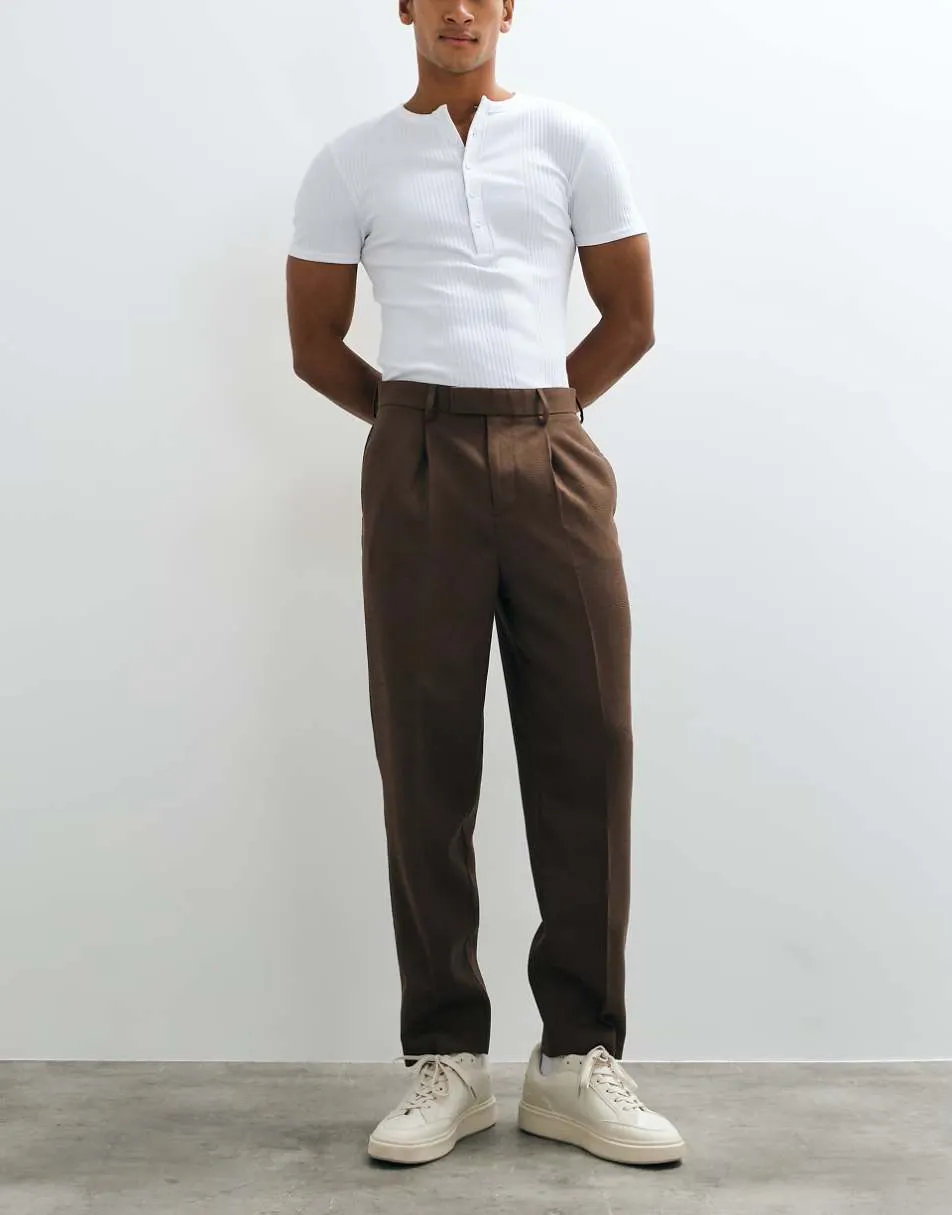 ASOS DESIGN tailored pleated relaxed tapered trousers in brown microtexture