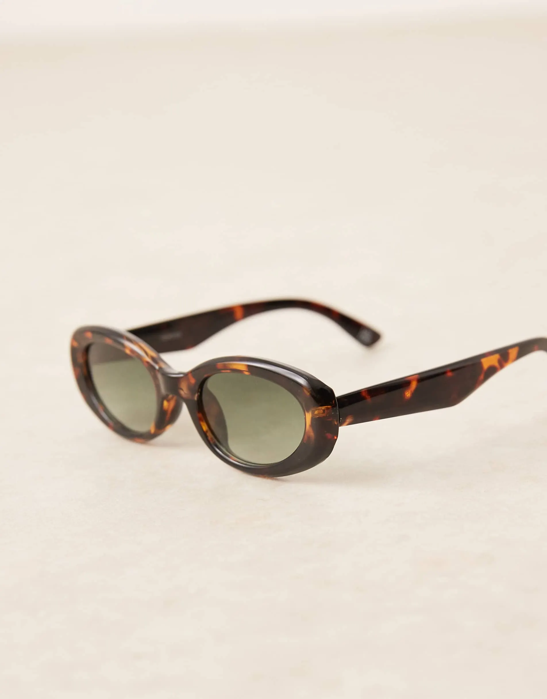 ASOS DESIGN oval sunglasses in tort with green lenses