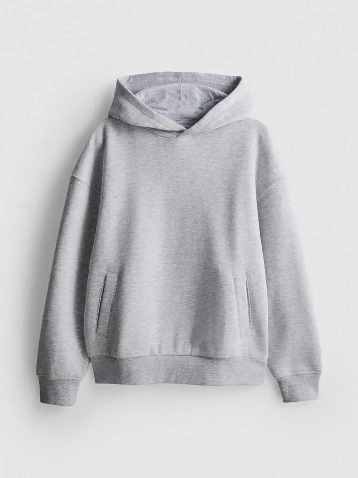 7–15 ans | Sweat à capuche en coton majoritaire