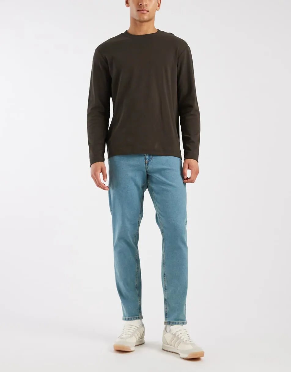 ASOS DESIGN stretch tapered jeans in tinted light wash blue