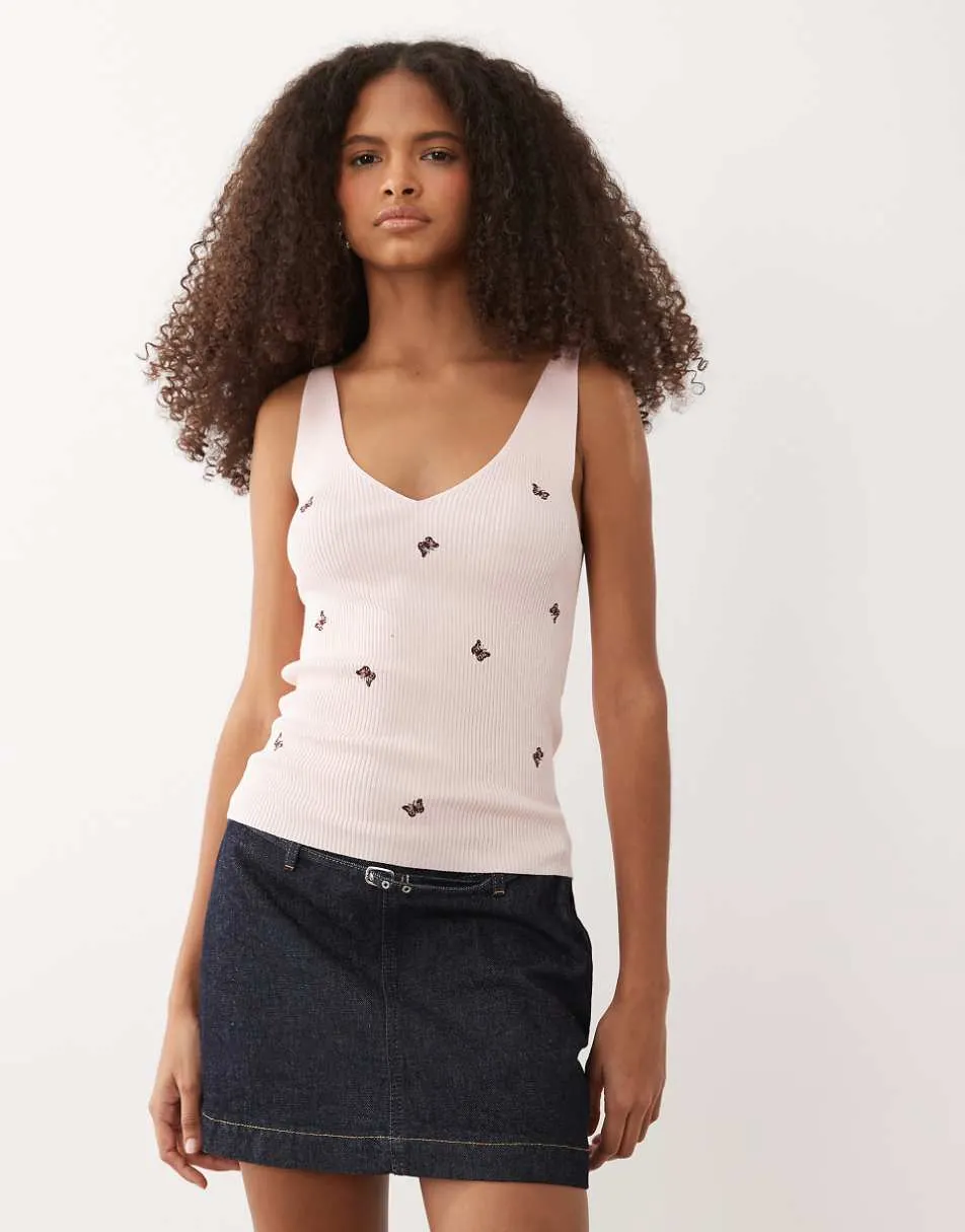 JDY knitted vest in pink with butterfly embroidery