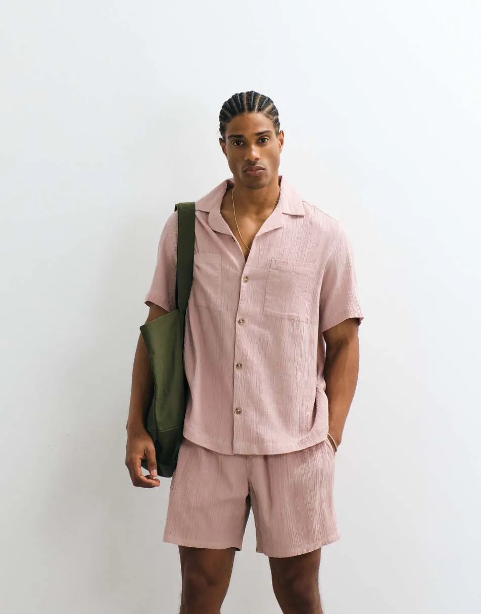 ASOS DESIGN co-ord crinkle texture shorts in mid length in pink