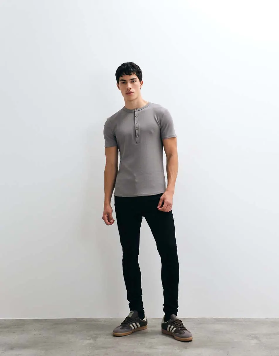 ASOS DESIGN spray on jeans with power stretch in black