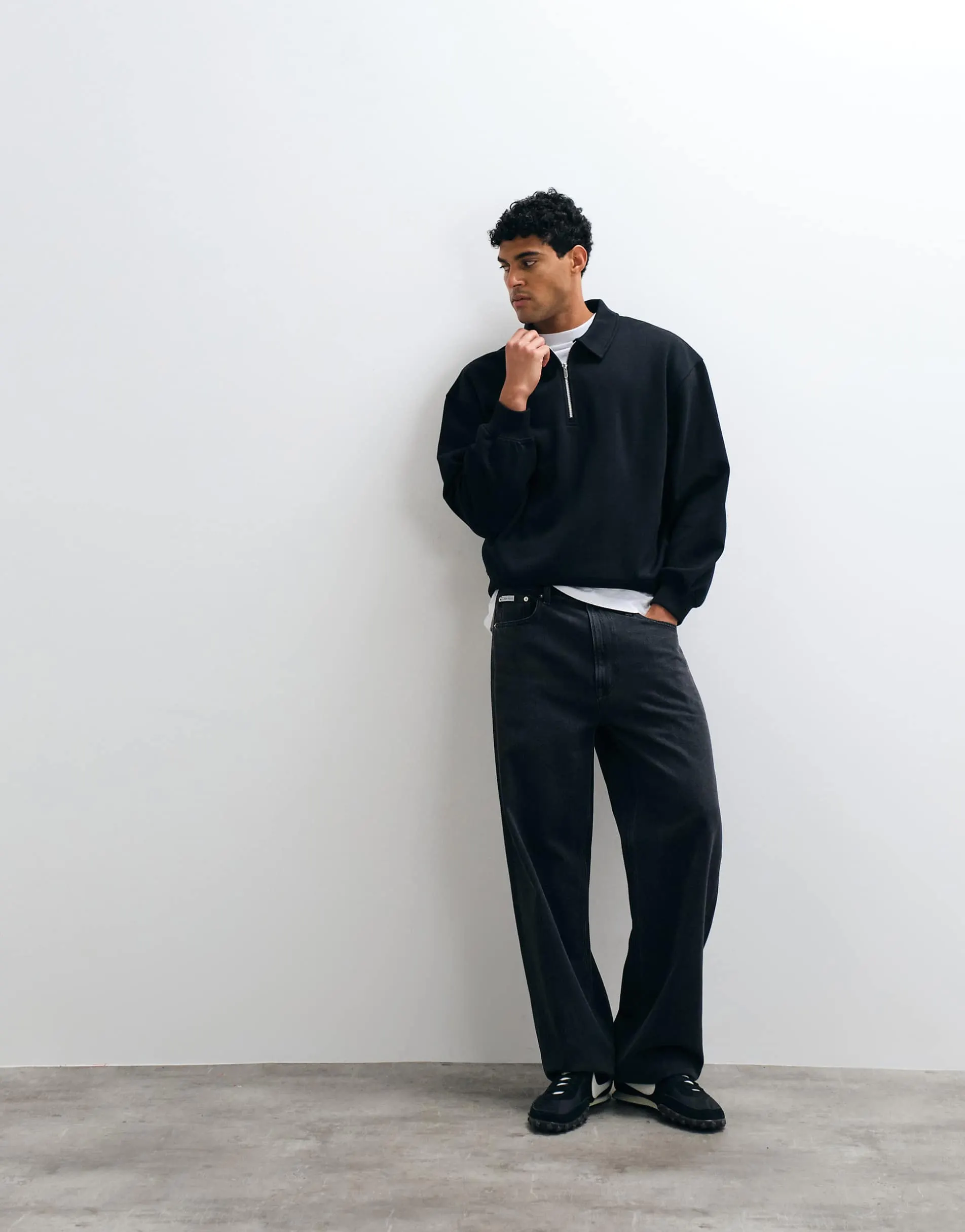ASOS DESIGN oversized boxy polo with quarter zip in black