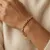 Armband in edelstaal, gedraaid met kralen