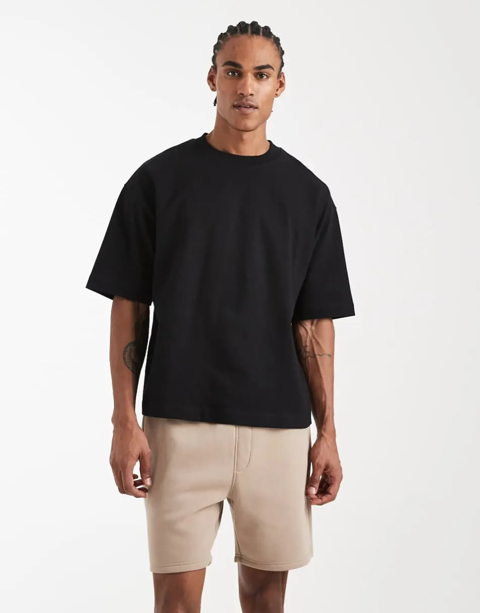 ASOS DESIGN essentials slim mid length jersey shorts in beige