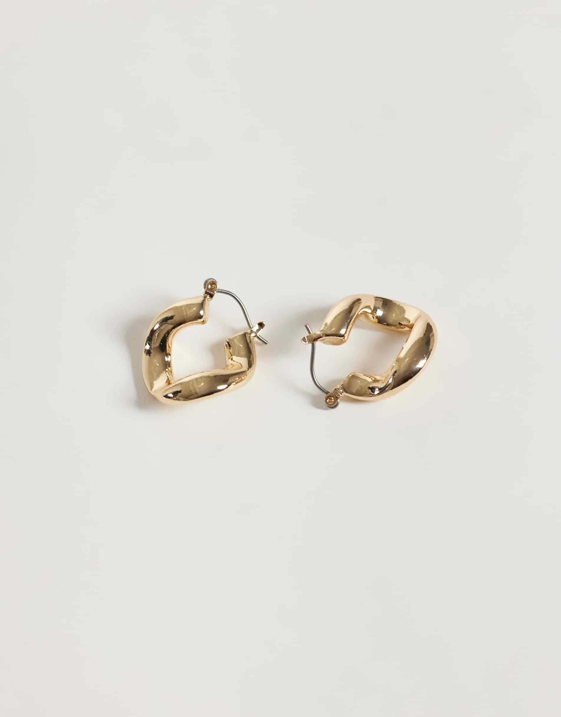 ASOS DESIGN small hoops with twisted design in gold tone