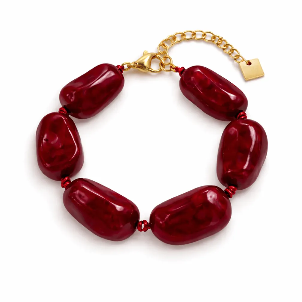 Armband in edelstaal, rode kralen