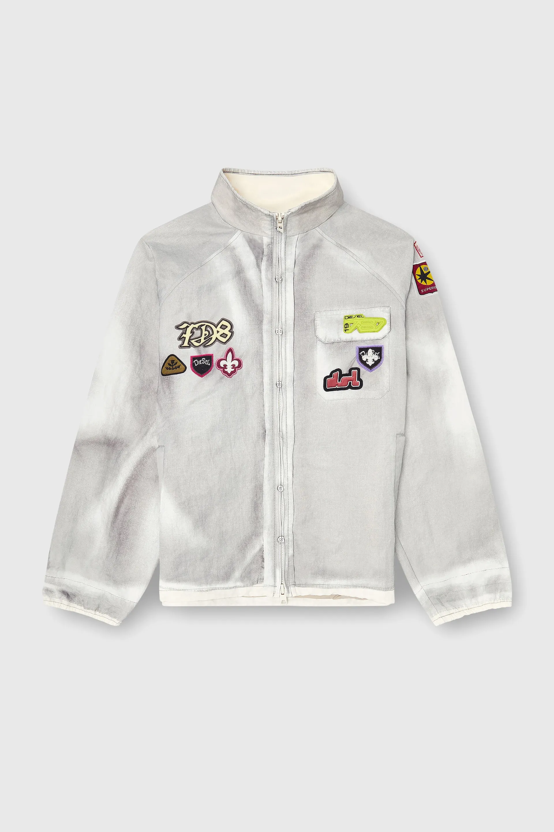 Windbreaker with trompe l’oeil patches