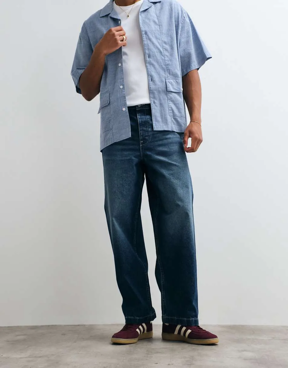 ASOS DESIGN loose straight jeans in dark wash blue with pleats and buckle