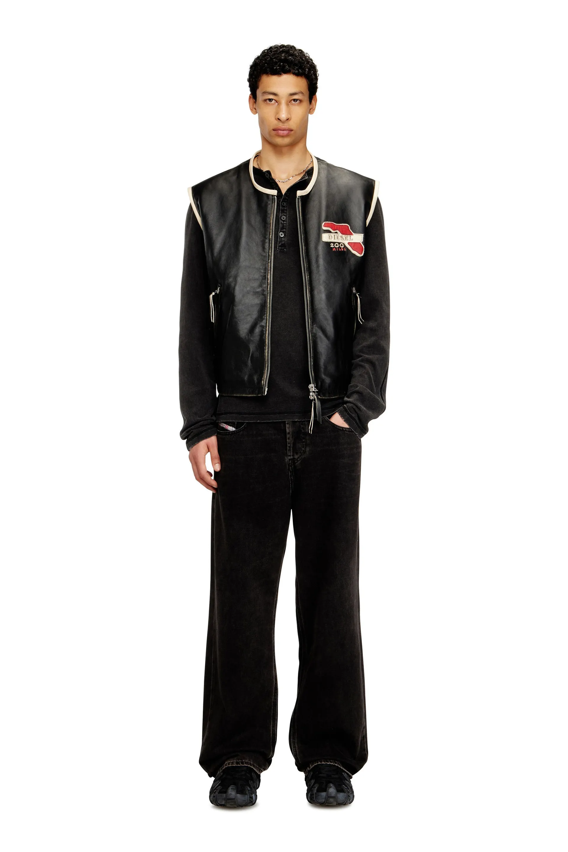 Leather vest with embroidered patches