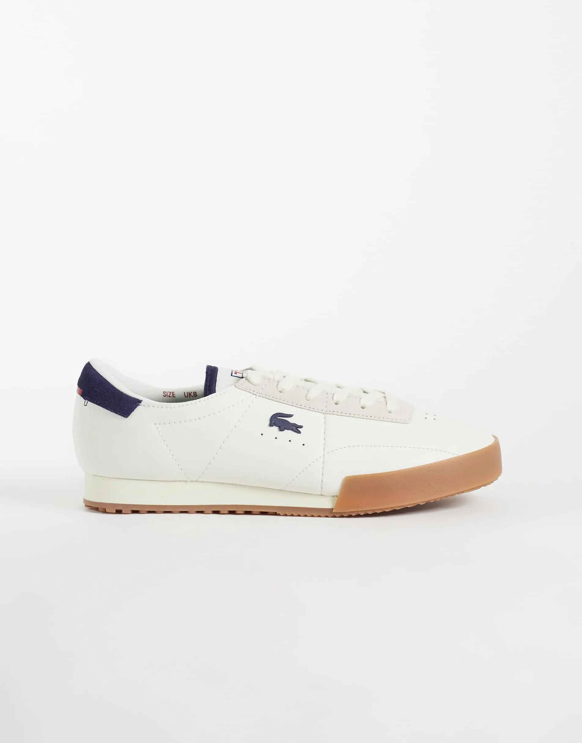 Lacoste aura gumsole trainer in navy and white