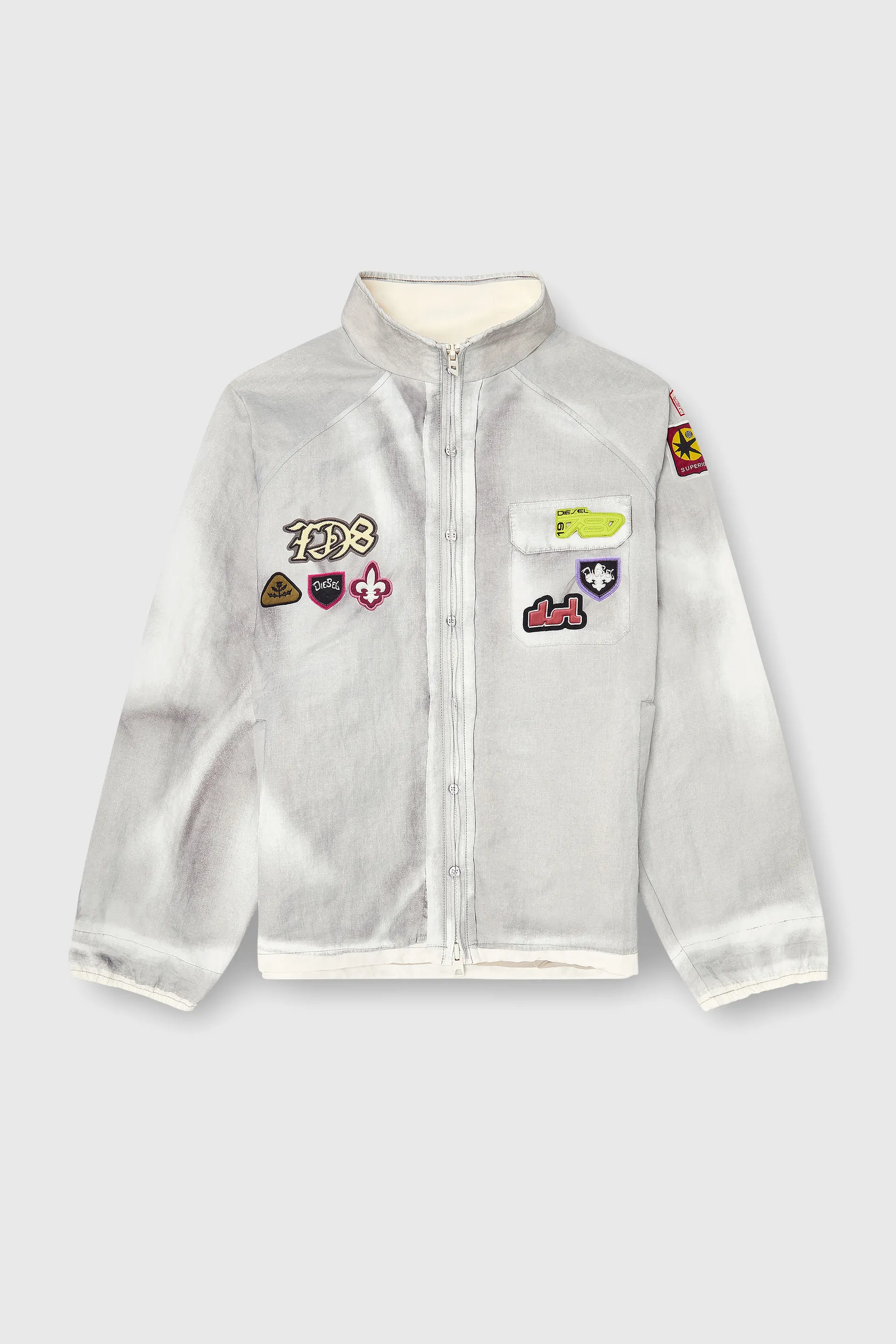 Windbreaker with trompe l’oeil patches