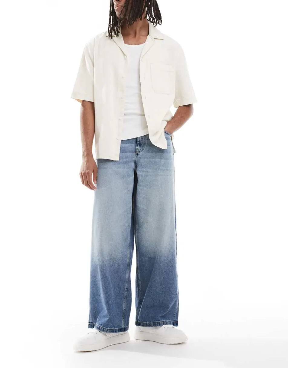ASOS DESIGN loose fit jeans in mid wash blue with tint