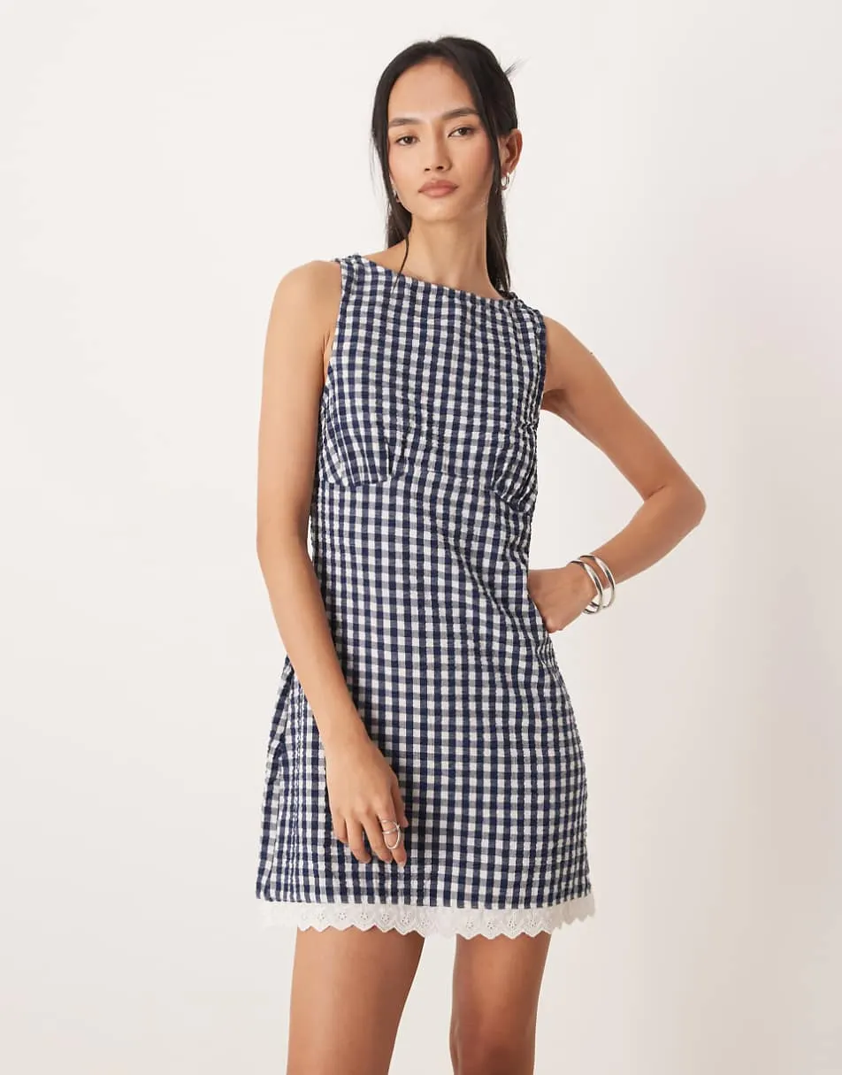 ASOS DESIGN slash neck mini sundress with sculpted bust and broderie hem in navy gingham
