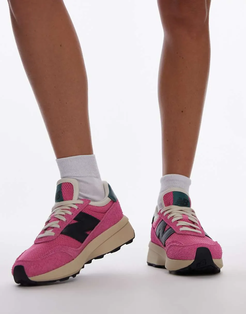 New Balance 370 trainers in pink and black