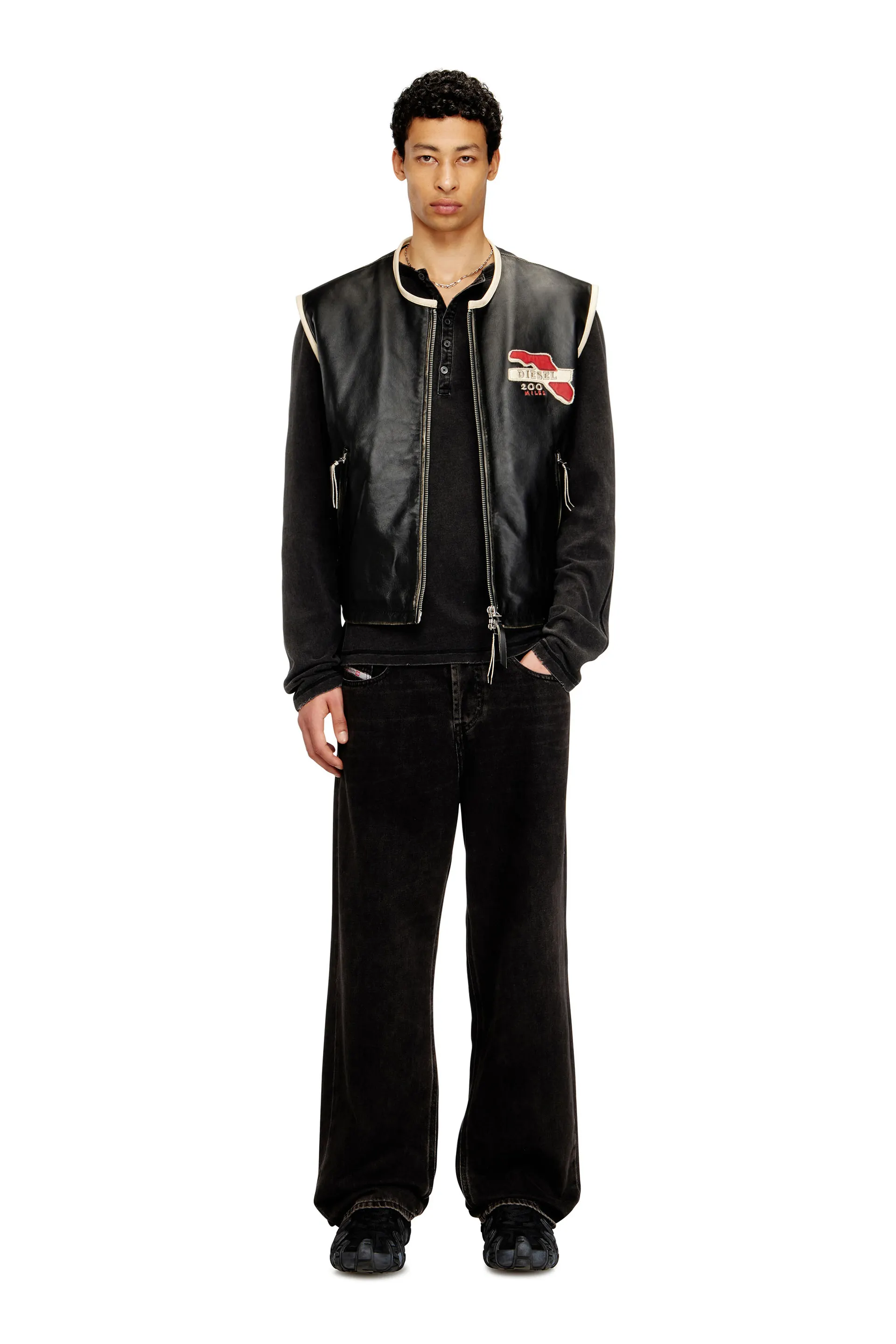 Leather vest with embroidered patches